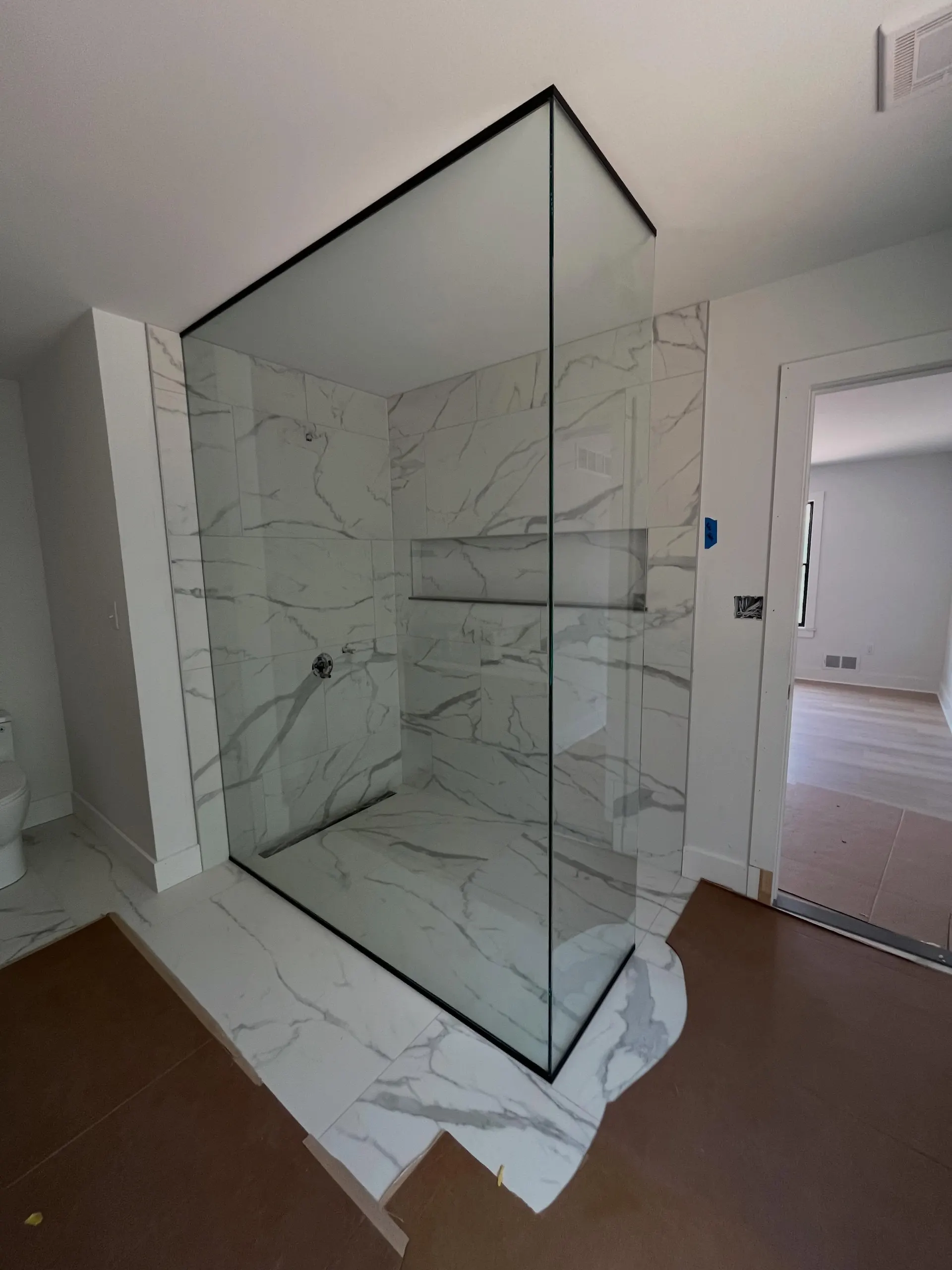 Glass shower enclosure work by Mesko Glass.